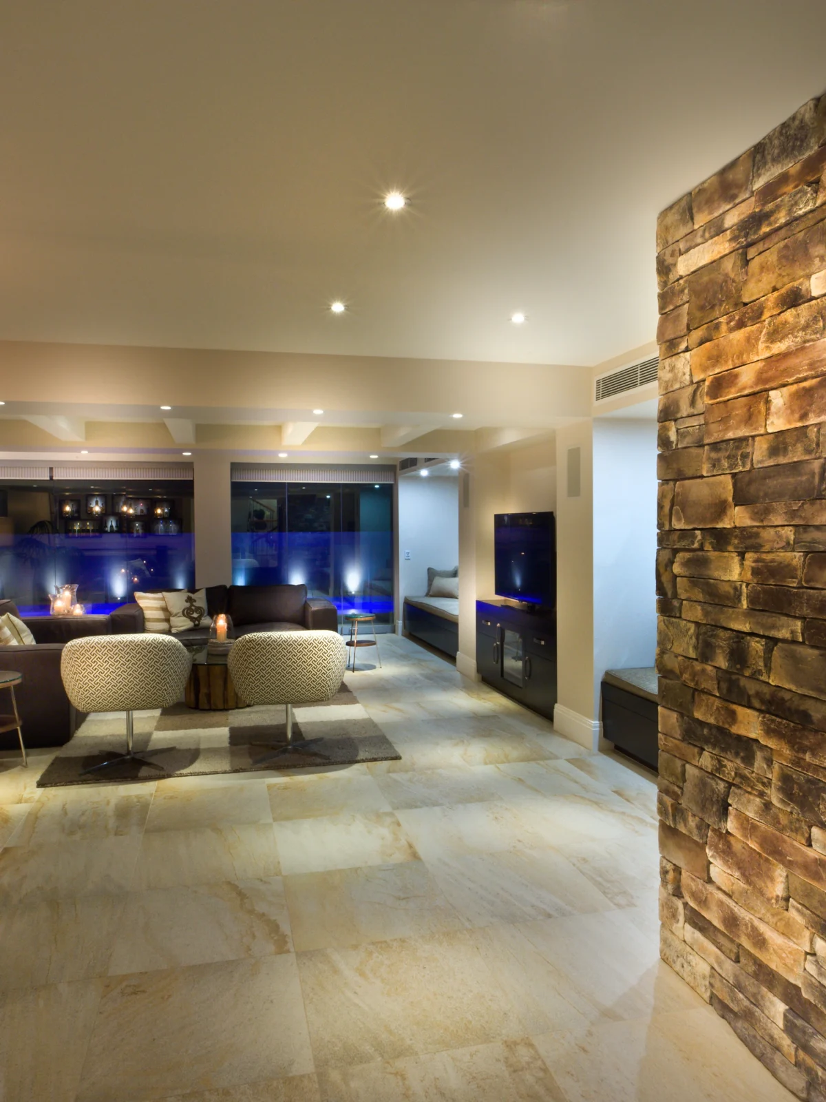 Modern basement living room renovation with bar area by Renavo Build