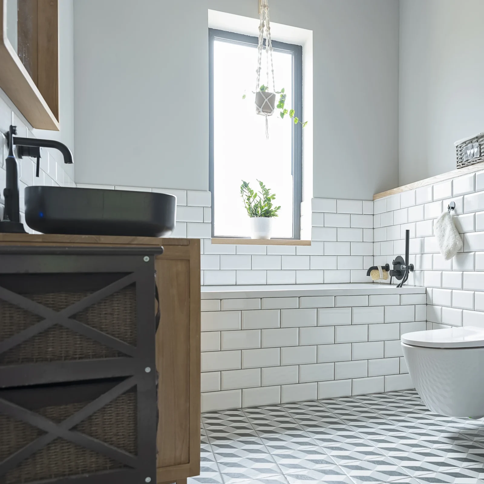 Modern bathroom loft conversion with white tiles and wooden accents