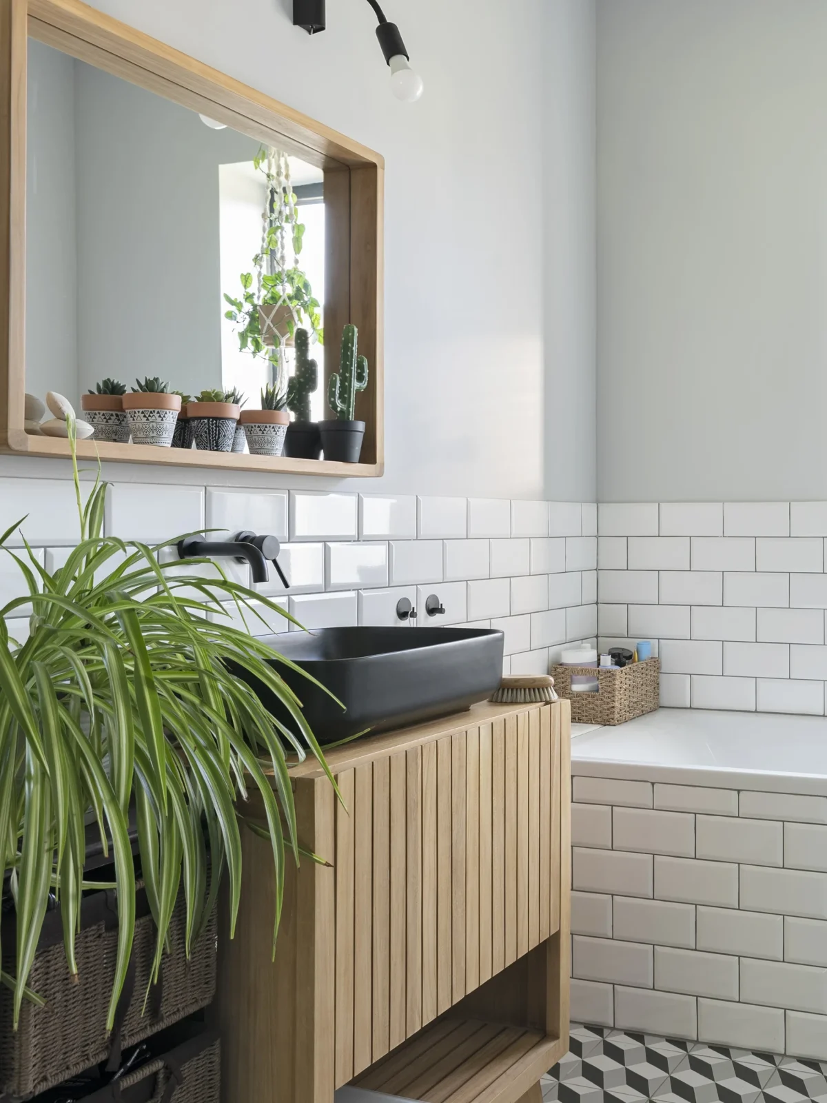 Loft conversion bathroom design with bathtub and black sink