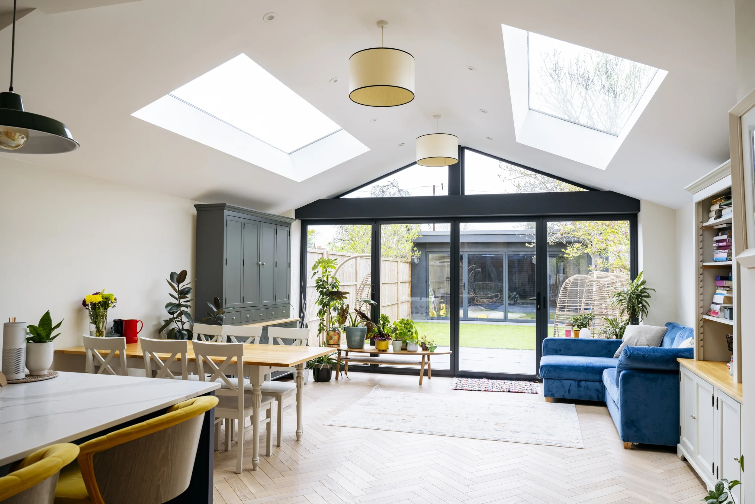 Open plan kitchen extension with skylights and garden view by Renavo Build