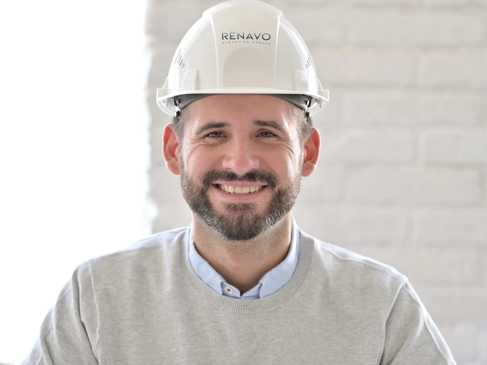 Portrait of Renavo Build architect wearing safety helmet